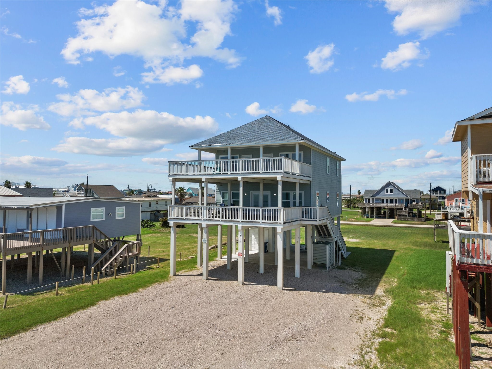 718 Beach Drive Surfside Beach, TX 77541 - Photo 2 of 49 Coastal paradise with breathtaking ocean views, just steps from the beach. Enjoy serene living in a well-spaced neighborhood under clear skies. Perfect for beach enthusiasts seeking tranquility.