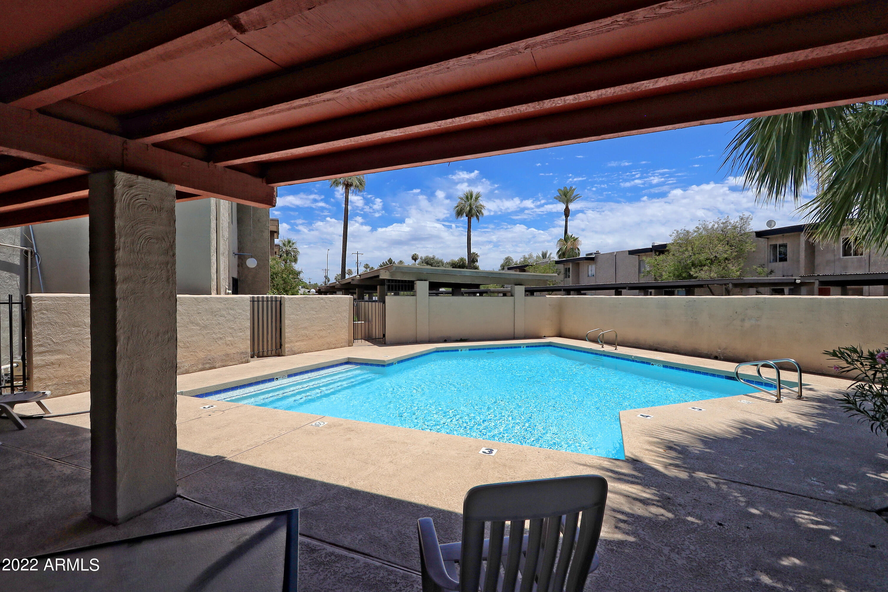 6348 North 7th Avenue, Unit 12 Phoenix, AZ 85013 - Photo 20 of 22 a view of a swimming pool with seating space
