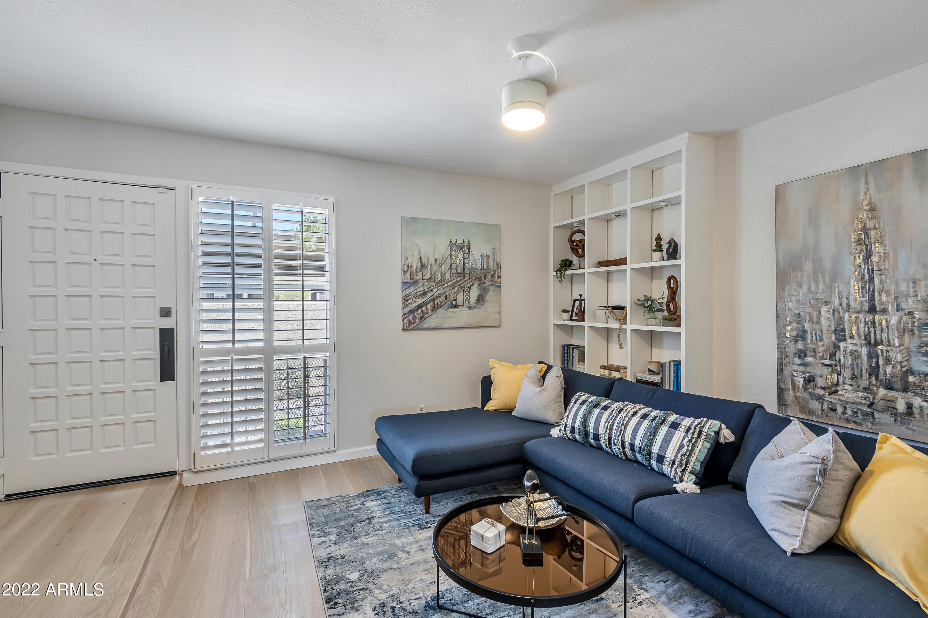 6348 North 7th Avenue, Unit 12 Phoenix, AZ 85013 - Photo 2 of 22 a living room with furniture and a wooden floor