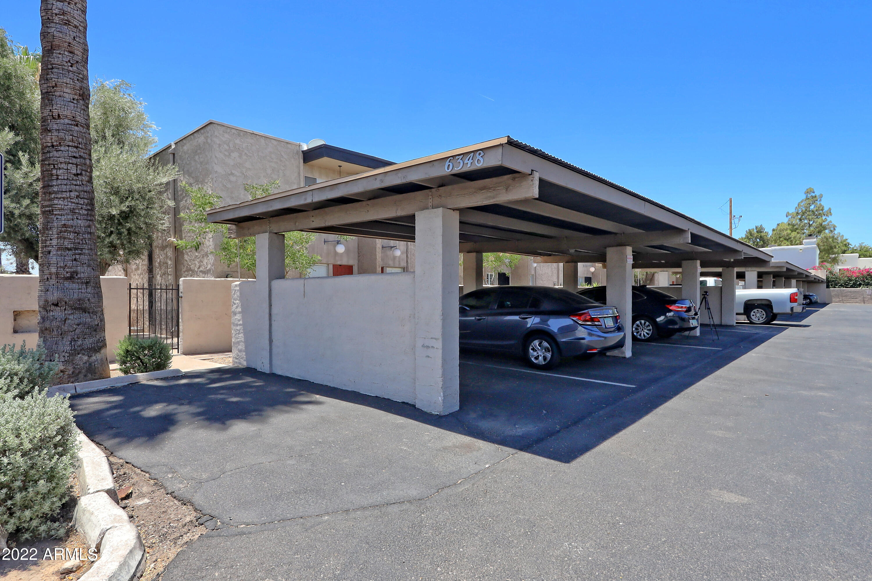 6348 North 7th Avenue, Unit 12 Phoenix, AZ 85013 - Photo 22 of 22 a car parked in front of a house