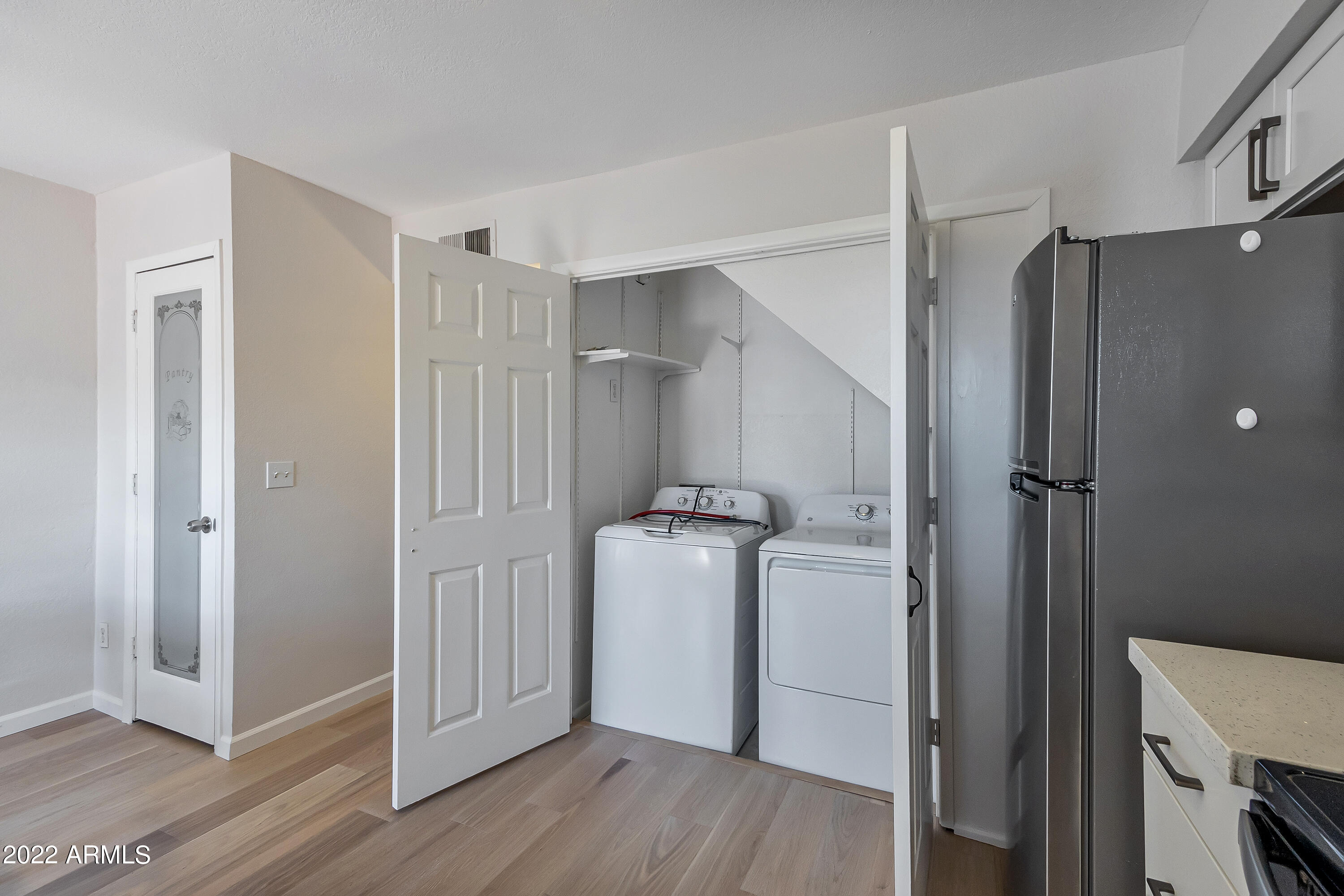 6348 North 7th Avenue, Unit 12 Phoenix, AZ 85013 - Photo 9 of 22 a view of a storage & utility room with a washer dryer
