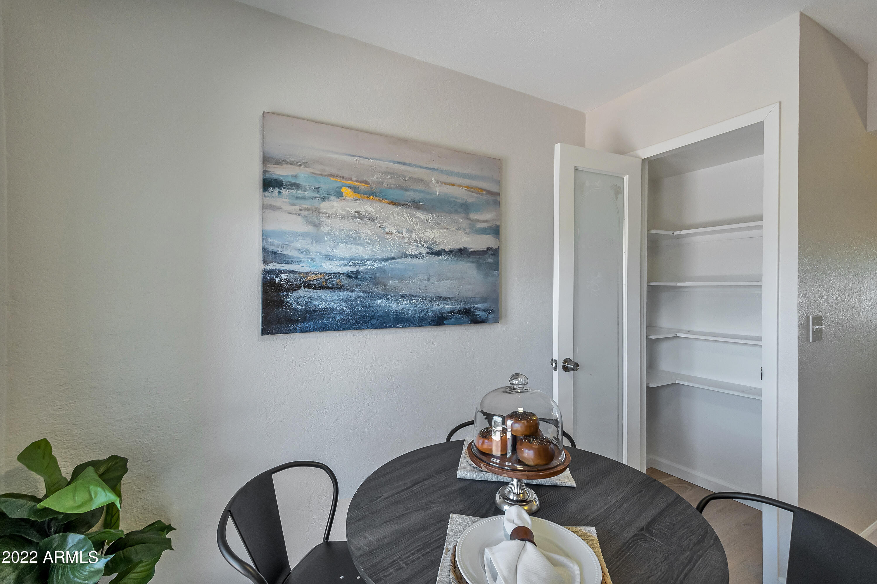 6348 North 7th Avenue, Unit 12 Phoenix, AZ 85013 - Photo 10 of 22 a room with a wooden floor