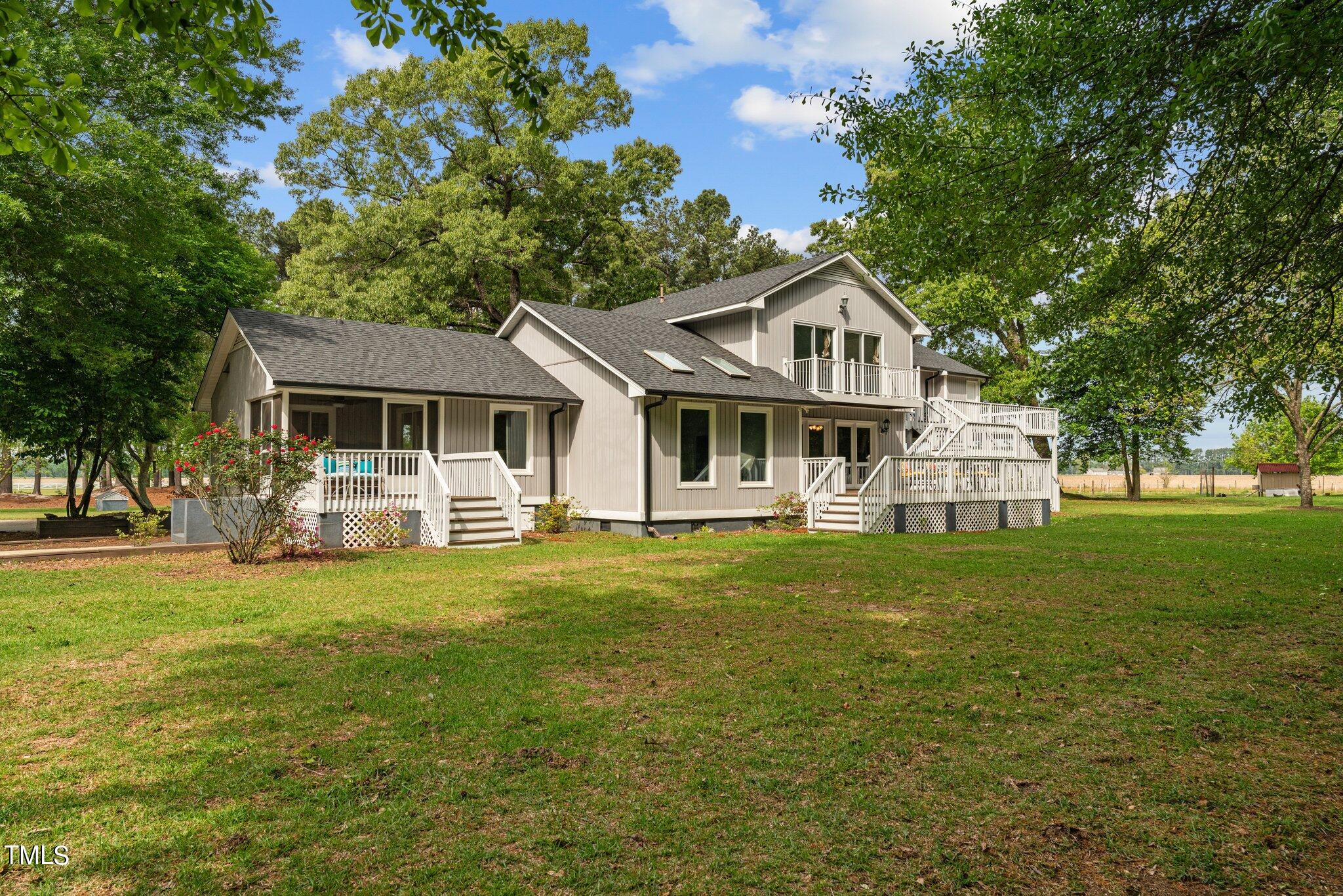 744 Alderman Mill Road Dunn, NC 28334 - Photo 2 of 50 a front view of a house with a garden