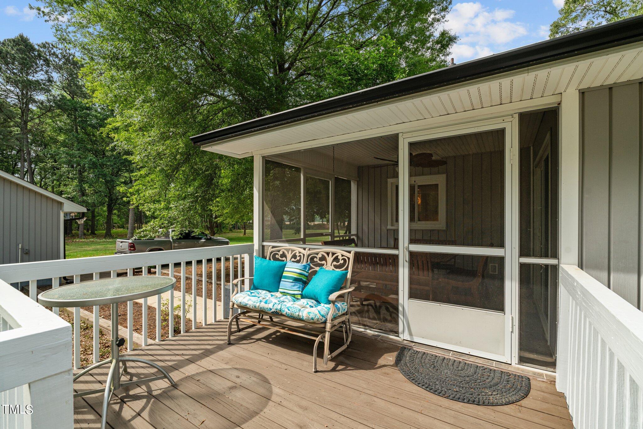 744 Alderman Mill Road Dunn, NC 28334 - Photo 35 of 50 a view of a patio with a table and chairs