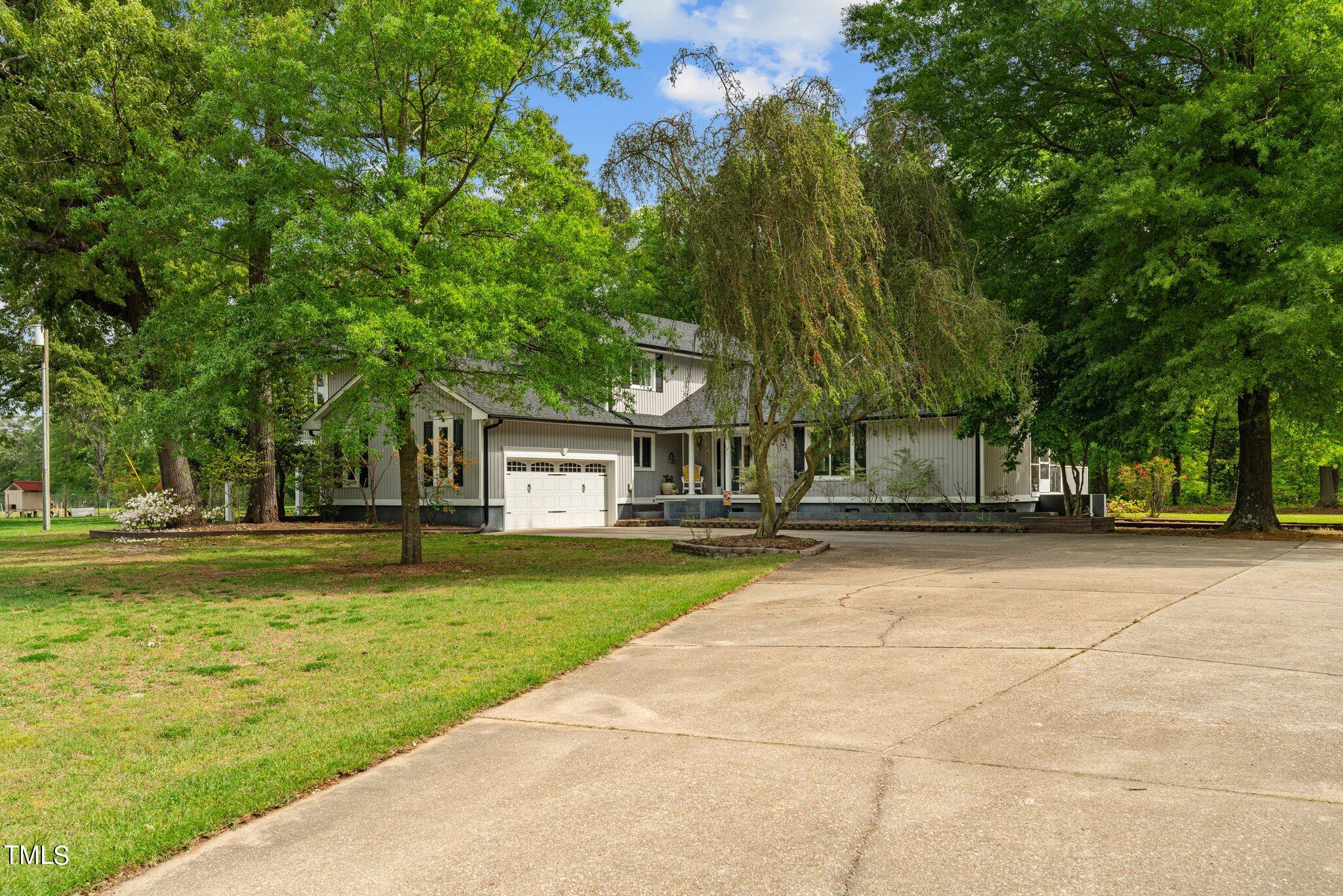 744 Alderman Mill Road Dunn, NC 28334 - Photo 4 of 50 a view of a house with a yard