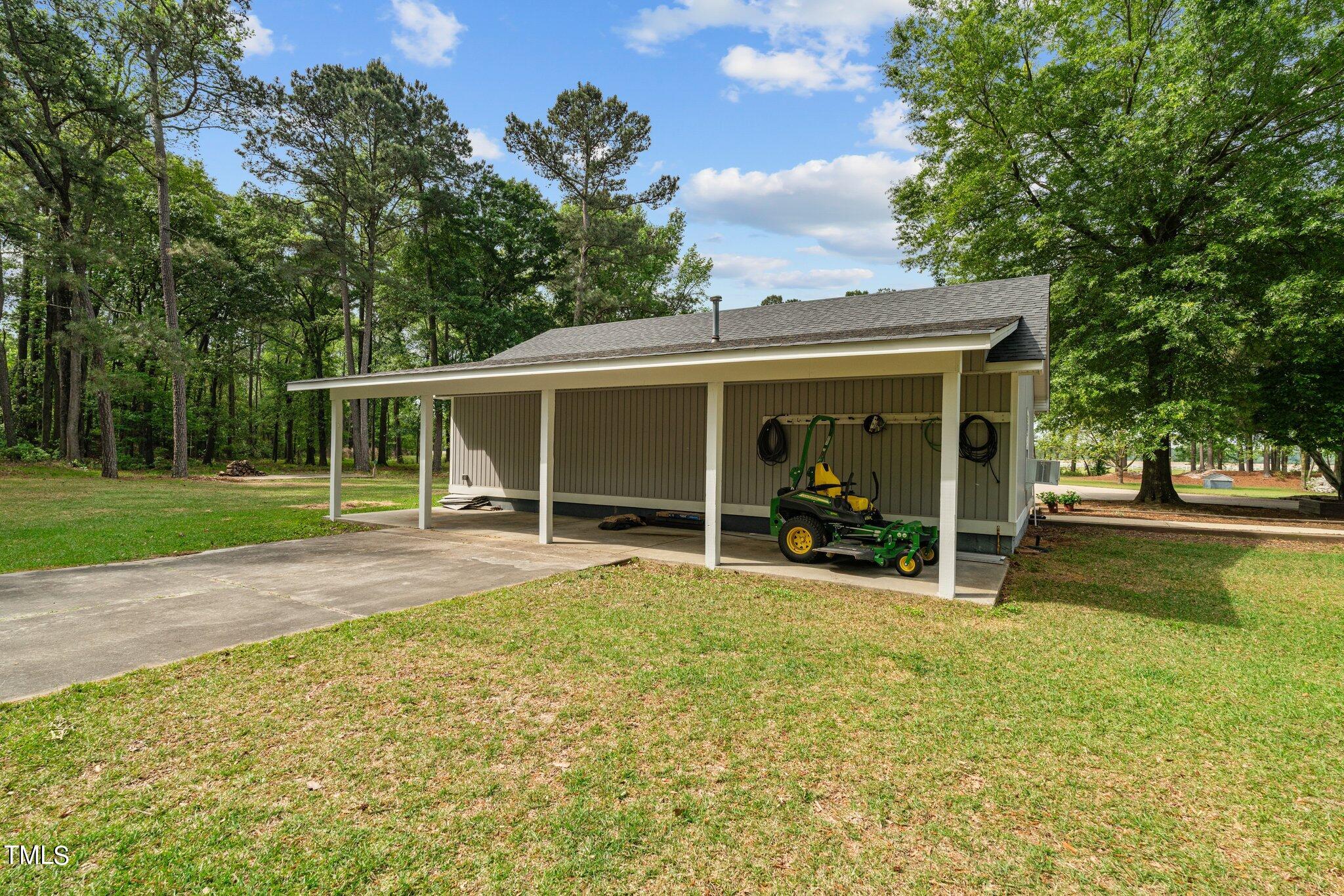 744 Alderman Mill Road Dunn, NC 28334 - Photo 41 of 50 a view of a house with a yard and sitting area