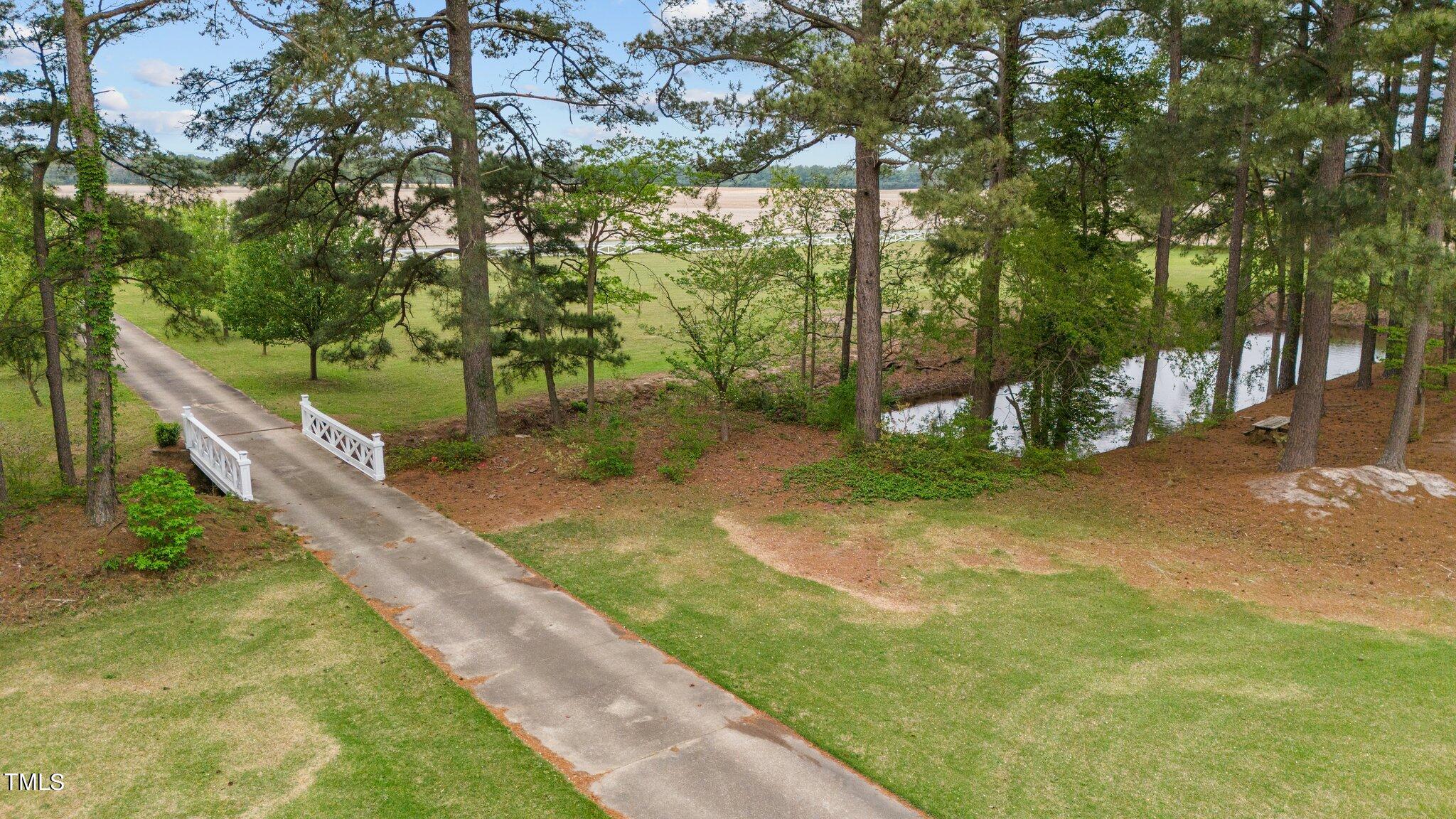 744 Alderman Mill Road Dunn, NC 28334 - Photo 47 of 50 a view of a yard with a tree