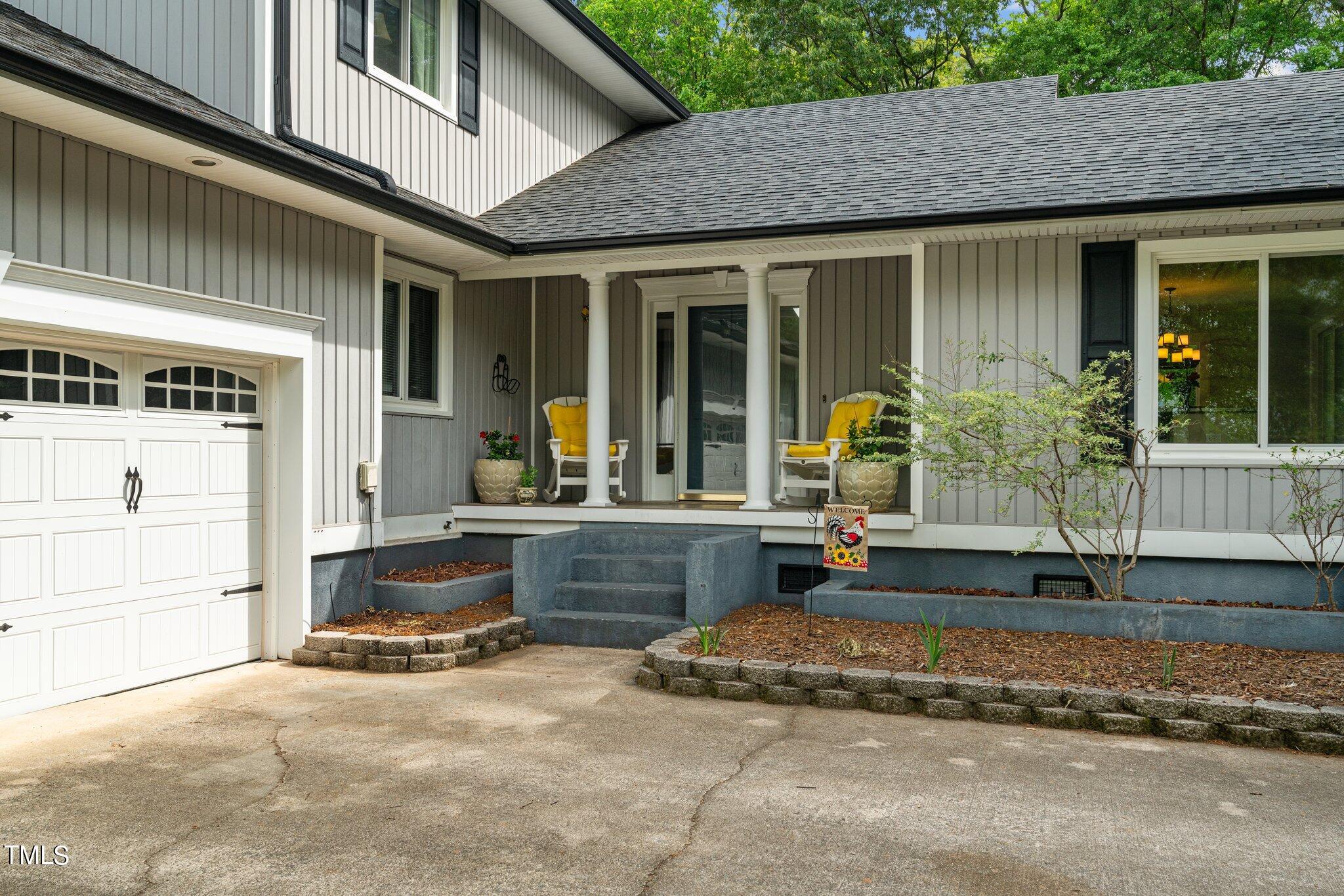 744 Alderman Mill Road Dunn, NC 28334 - Photo 5 of 50 a front view of a house with garden