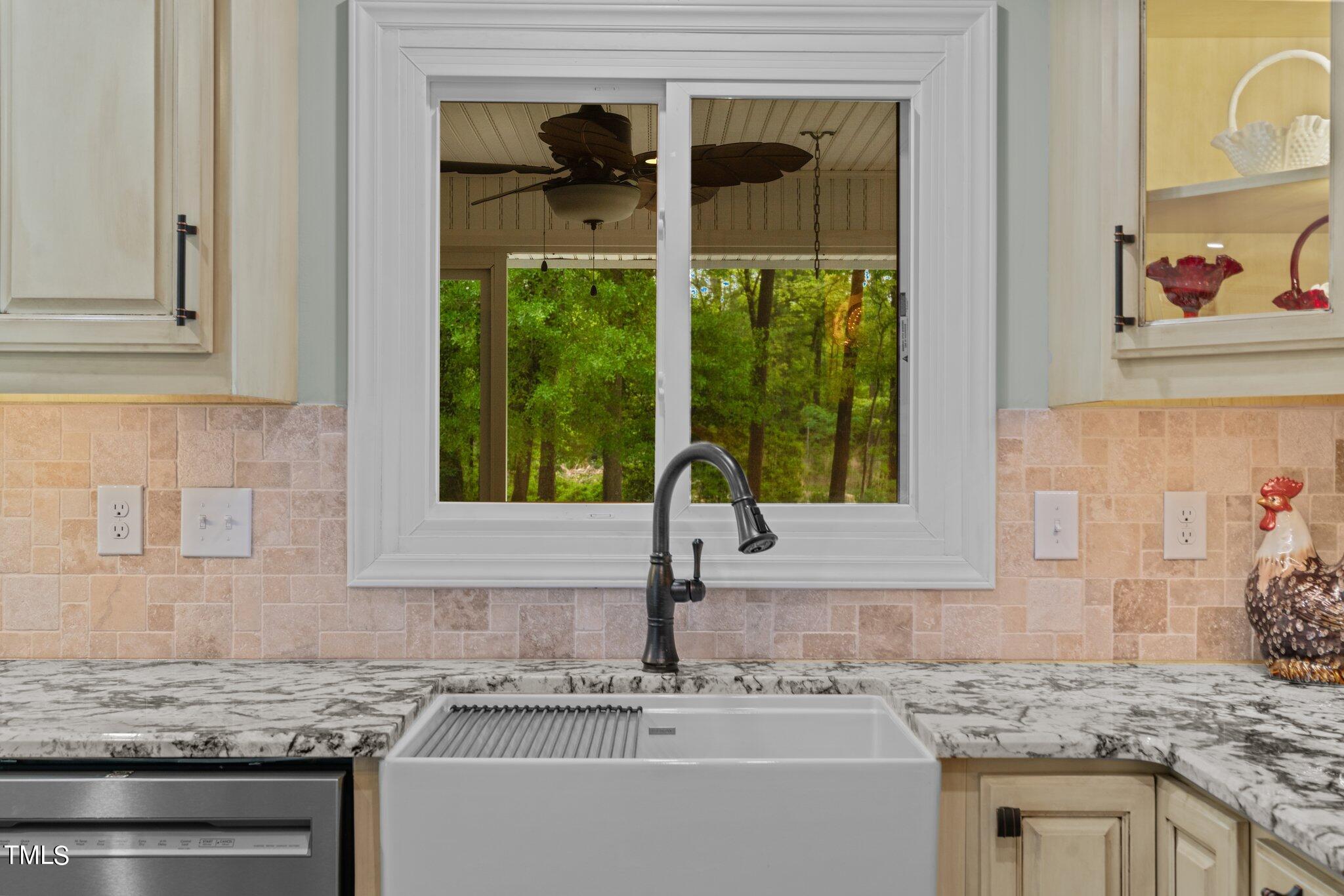 744 Alderman Mill Road Dunn, NC 28334 - Photo 8 of 50 a kitchen with granite countertop a sink and a window
