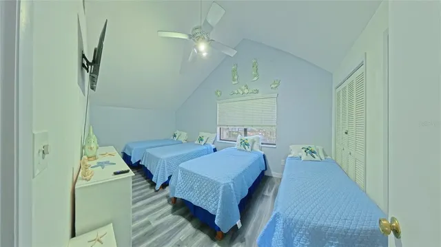 a bed room with a bed and a chandelier