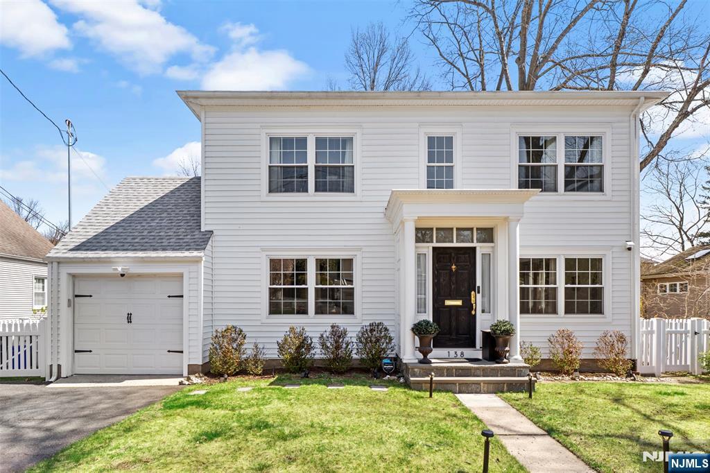 138 Brookside Avenue Cresskill, NJ 07626 - Photo 2 of 6 a front view of a house with a yard