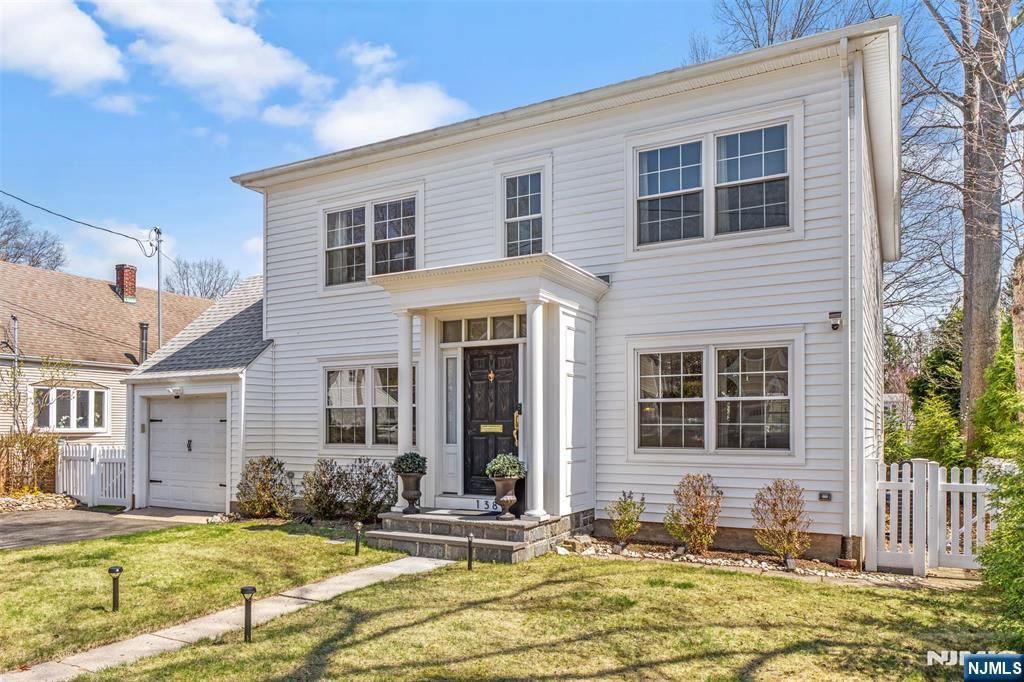 138 Brookside Avenue Cresskill, NJ 07626 - Photo 4 of 6 a front view of a house with swimming pool