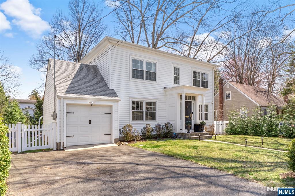 138 Brookside Avenue Cresskill, NJ 07626 - Photo 5 of 6 a view of a house with a yard and fence