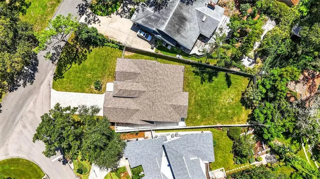 a view of swimming pool with a patio and garden
