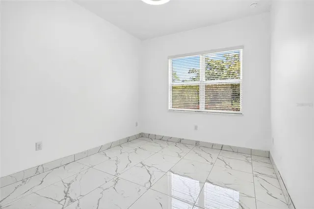 a house view with a sitting space and garden