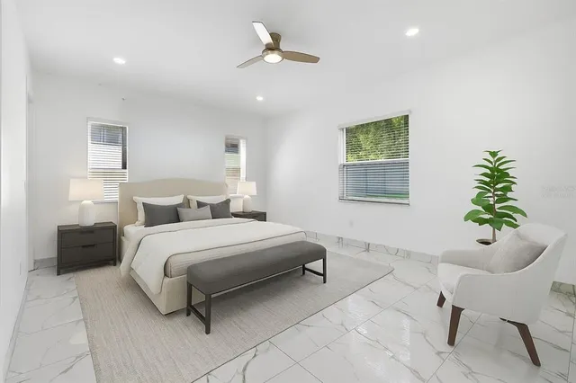 a bedroom with a bed and a chair