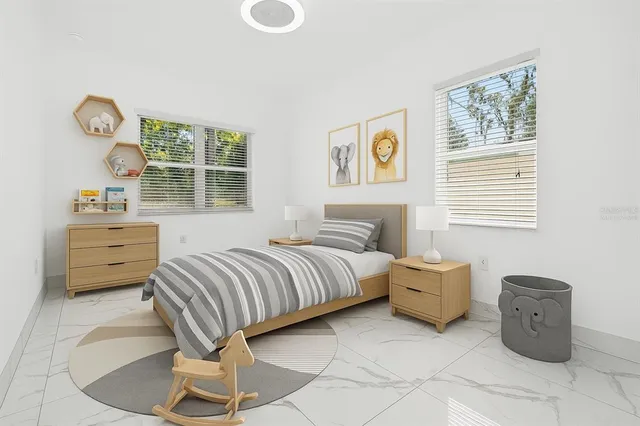 a view of a patio with couches chairs and a potted plant