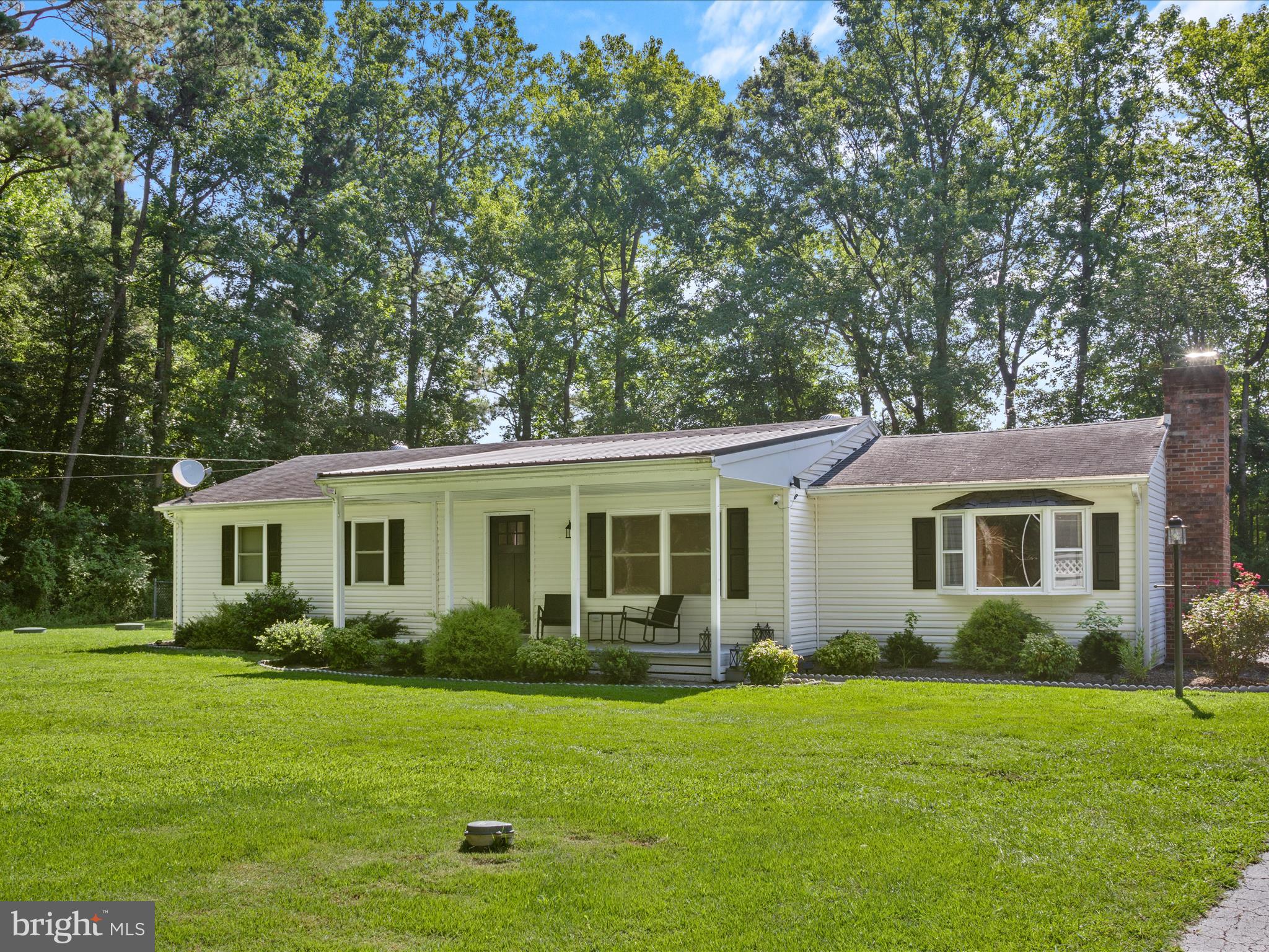 26831 River Road Seaford, DE 19973 - Photo 2 of 41 a front view of house with yard and green space