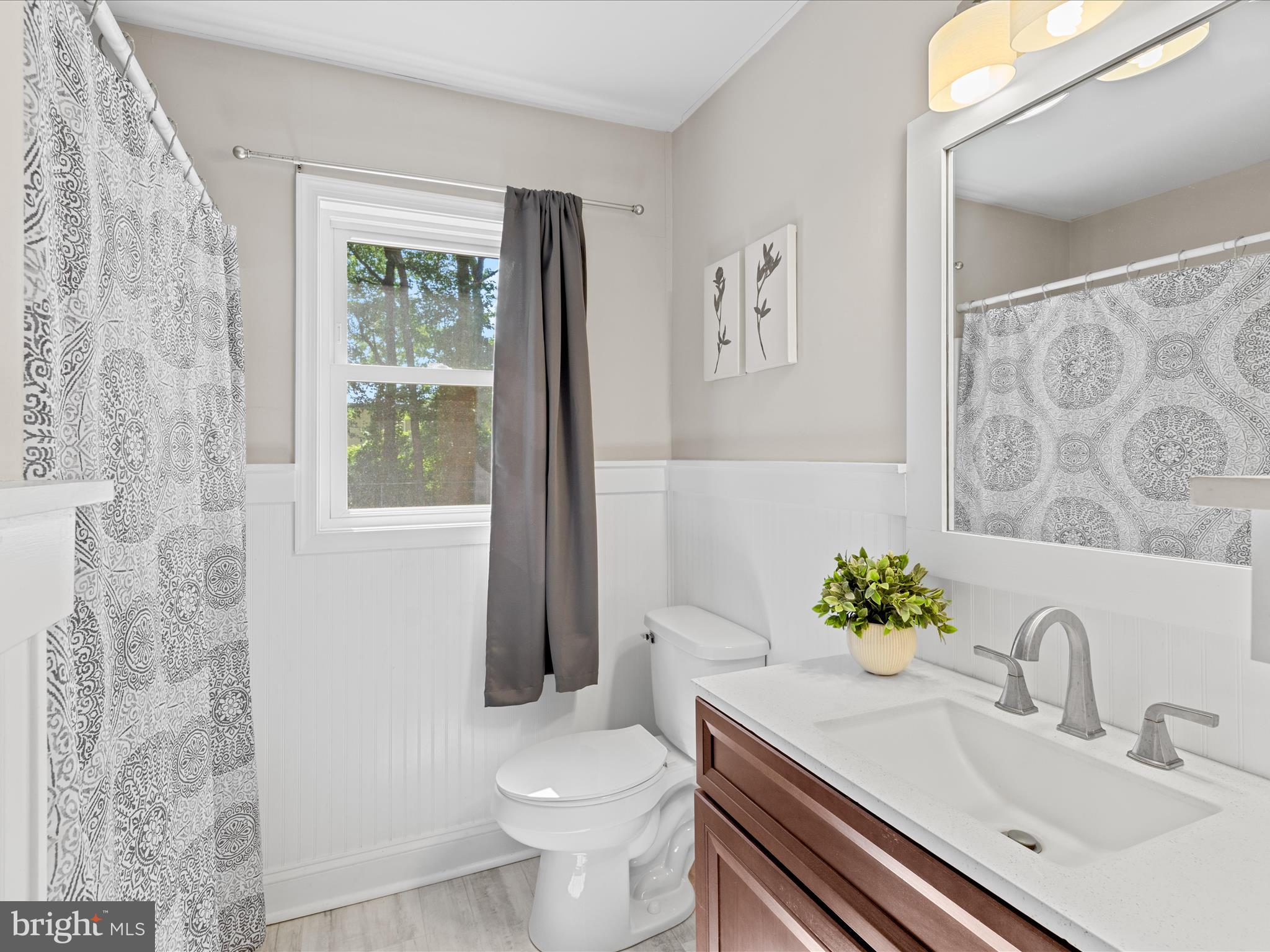 26831 River Road Seaford, DE 19973 - Photo 21 of 41 a bathroom with a sink toilet and a mirror