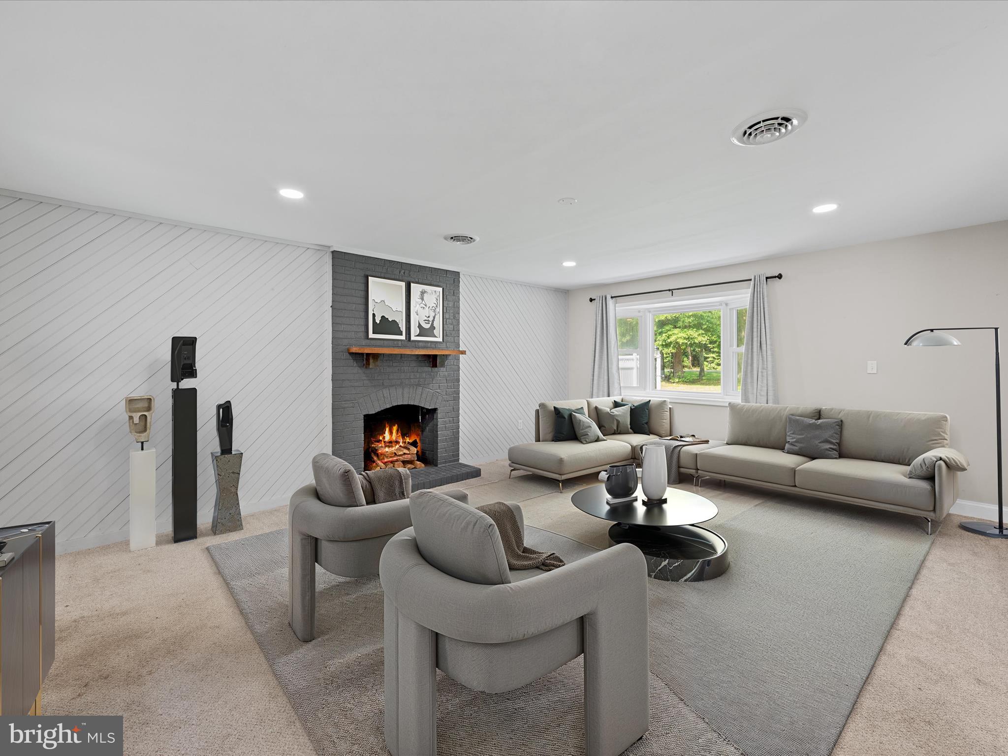 26831 River Road Seaford, DE 19973 - Photo 29 of 41 a living room with furniture and a fireplace