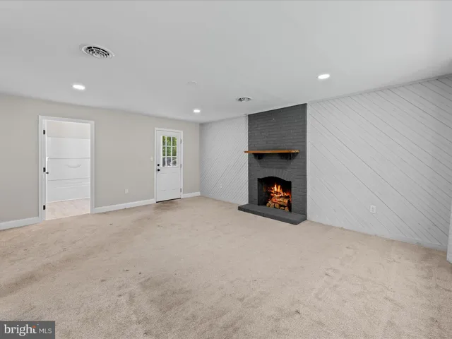 a view of a livingroom and a kitchen