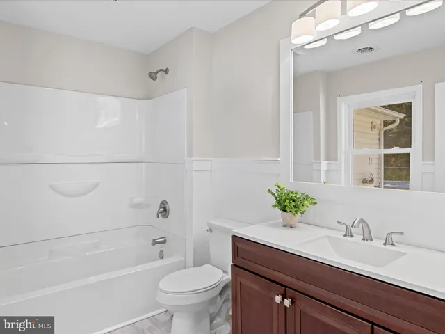 a view of an empty room with a fireplace