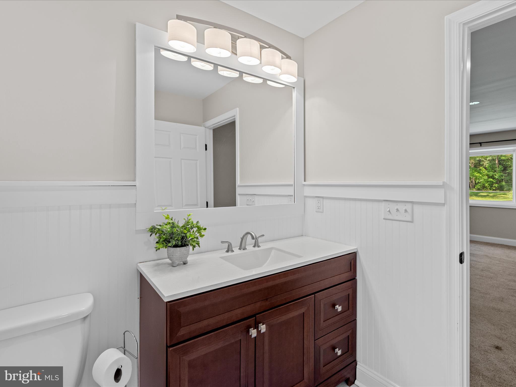 26831 River Road Seaford, DE 19973 - Photo 33 of 41 a bathroom with a sink vanity and a mirror