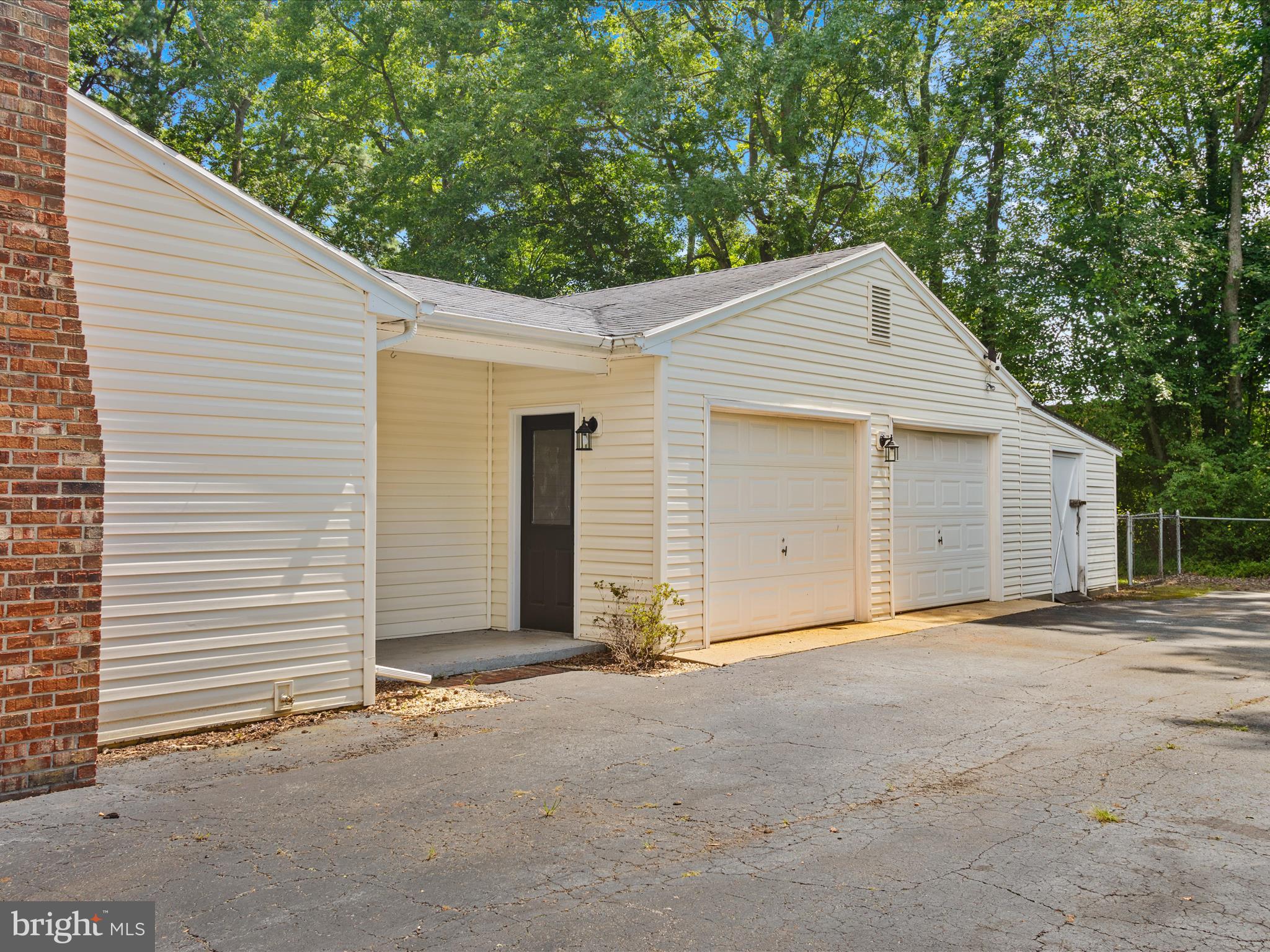 26831 River Road Seaford, DE 19973 - Photo 35 of 41 a view of a house with a garage and yard