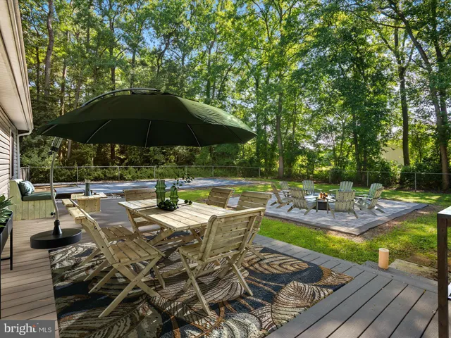 a view of a backyard with sitting area