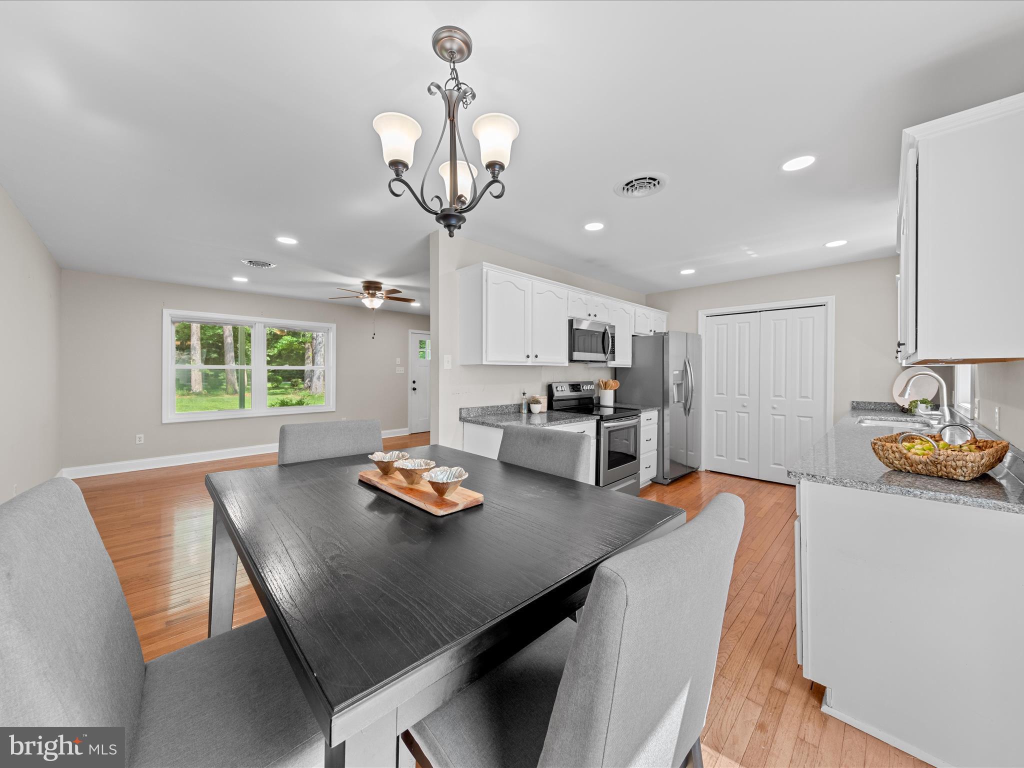 26831 River Road Seaford, DE 19973 - Photo 41 of 41 a open dining room with stainless steel appliances a table and chairs