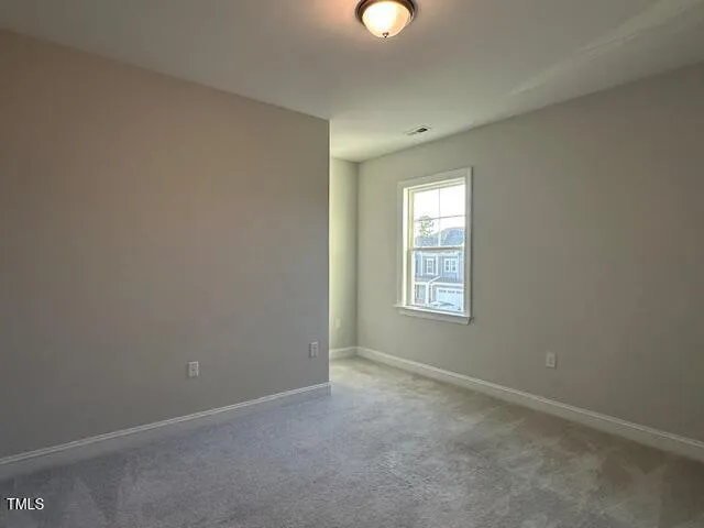 a spacious bathroom with a bathtub shower sink and mirror