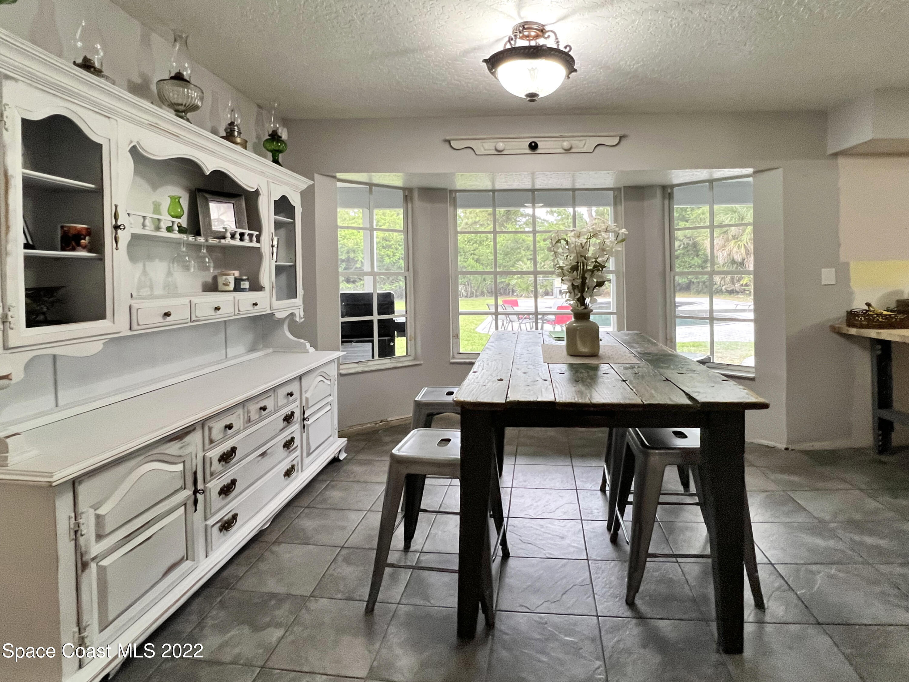 4030 Sparrow Hawk Road Melbourne, FL 32934 - Photo 19 of 46 DiningPoolView