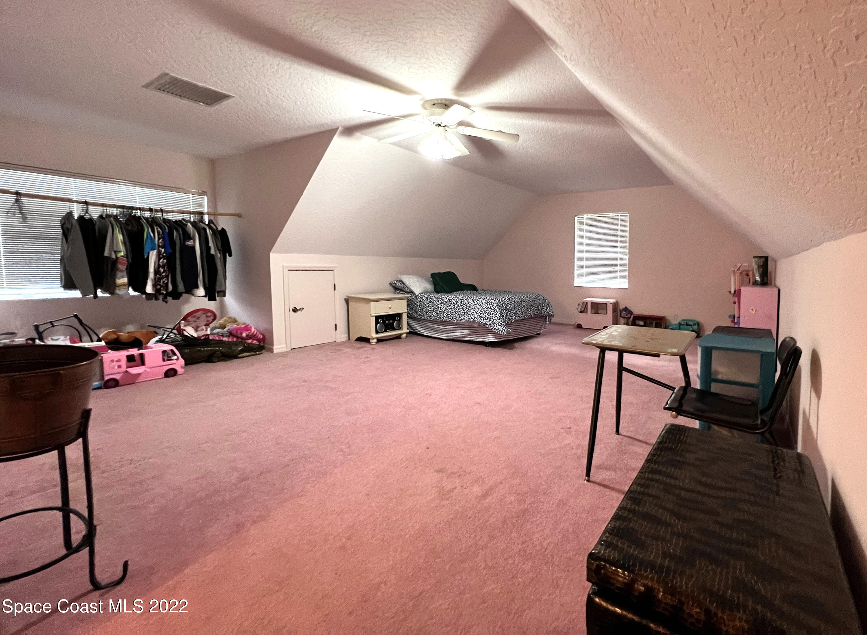 4030 Sparrow Hawk Road Melbourne, FL 32934 - Photo 44 of 46 a living room with furniture and a flat screen tv
