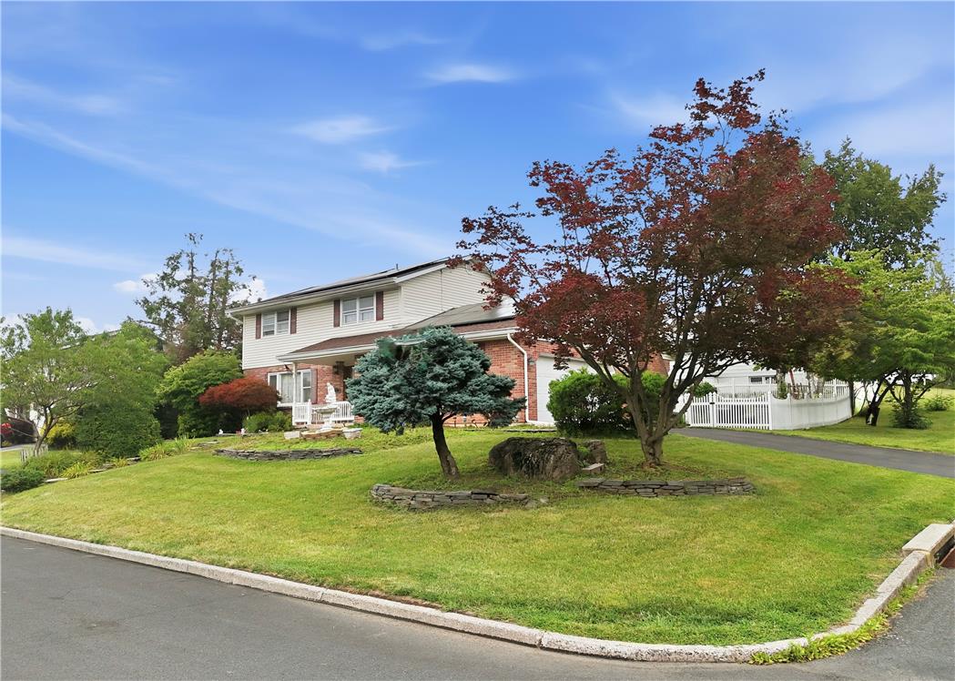3303 Barklay Road Whitehall, PA 18052 - Photo 2 of 31 Well-maintained curb appeal offers a manicured lawn and mature landscaping with vibrant trees.