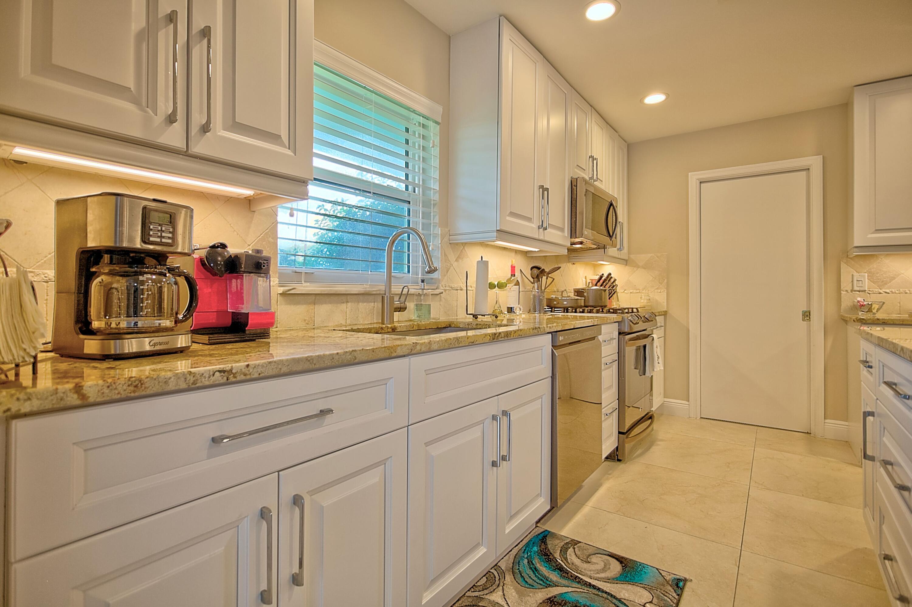 455 South Country Club Drive Atlantis, FL 33462 - Photo 4 of 18 Kitchen 2