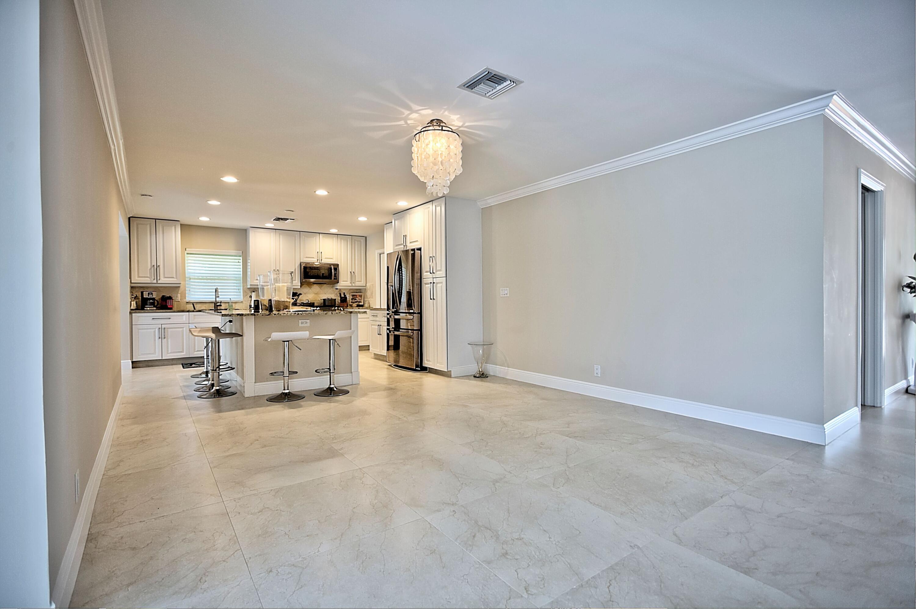 455 South Country Club Drive Atlantis, FL 33462 - Photo 5 of 18 Kitchen and Dining Area