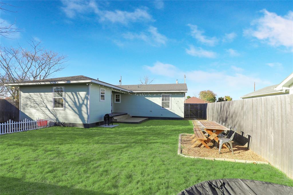 271 East Houston Street Van Alstyne, TX 75495 - Photo 30 of 40 a view of a backyard with a sitting area and slide