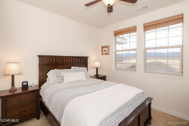164 Village Road, Unit H304 Granby, CO 80446 - Photo 19 of 50 a bedroom with a bed and a window