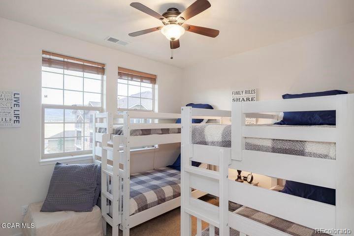 164 Village Road, Unit H304 Granby, CO 80446 - Photo 24 of 50 a bedroom with a bed and a window