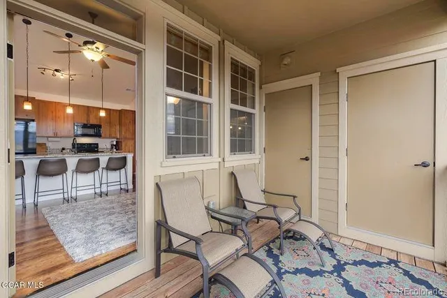 a view of a livingroom with furniture and windows