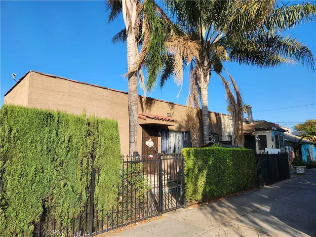 a view of a house with a tree