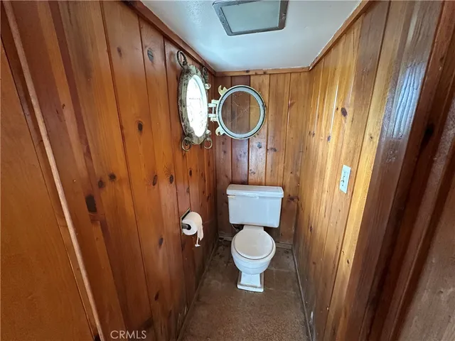 a bed room with a bed and a chair