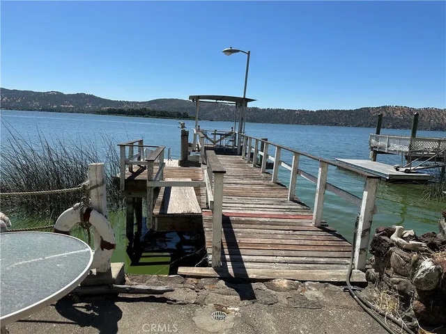 a view of a house with backyard porch and sitting area