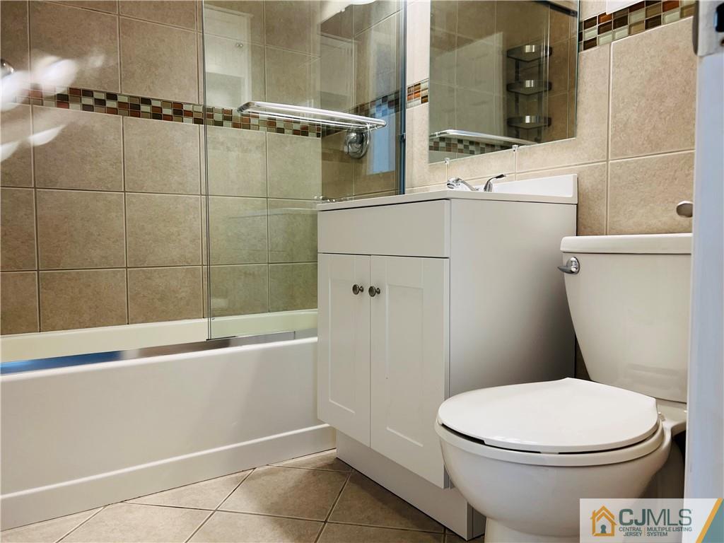 55 Glenville Road Edison, NJ 08817 - Photo 13 of 28 a bathroom with a toilet and a shower