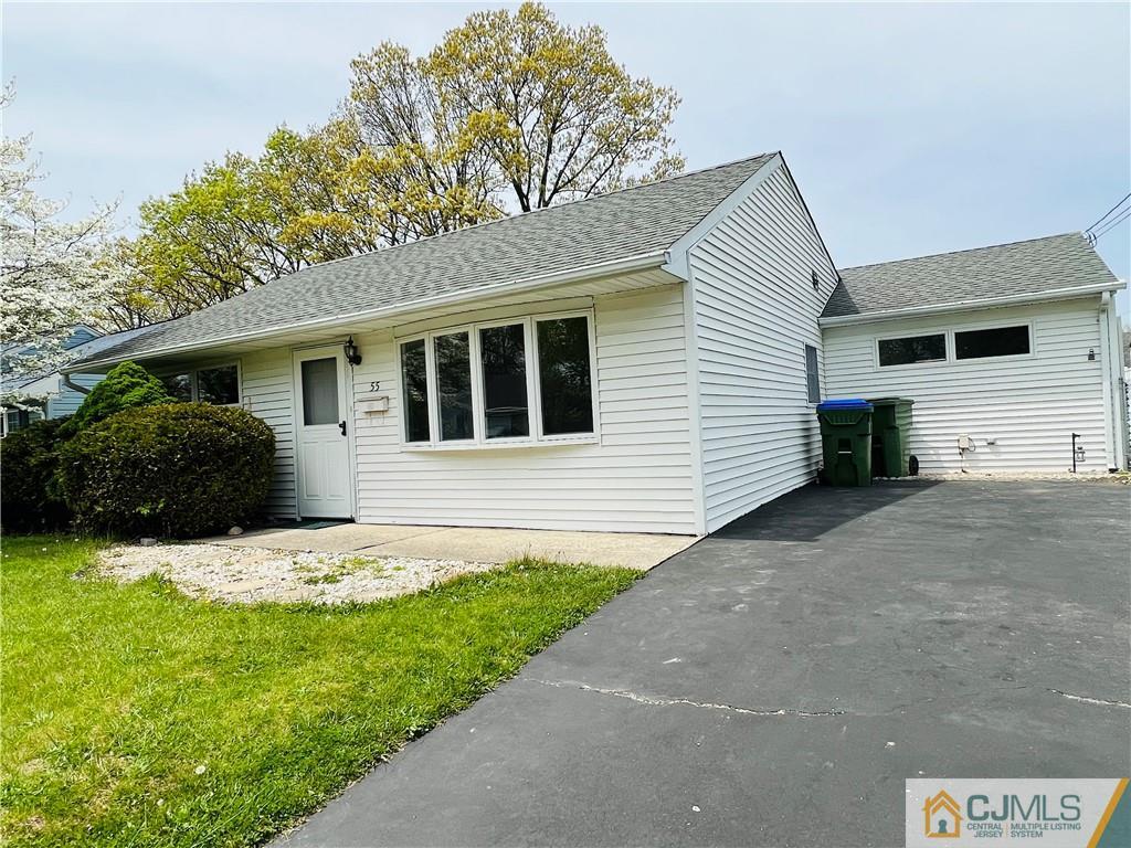 55 Glenville Road Edison, NJ 08817 - Photo 2 of 28 a front view of a house with a yard