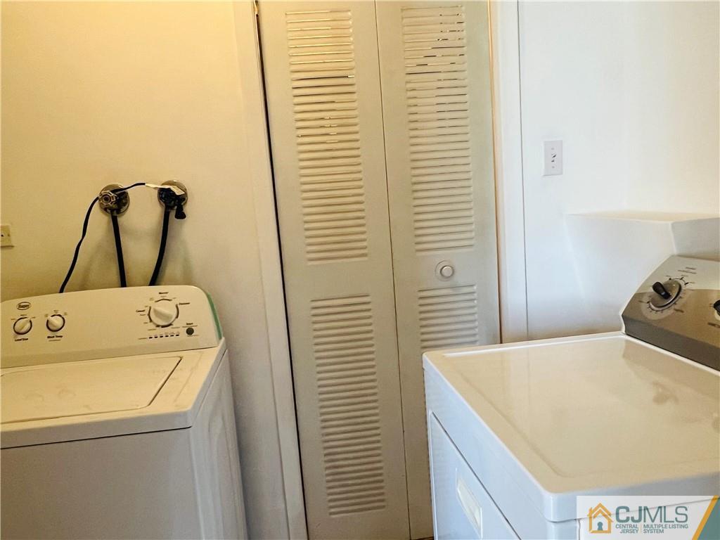55 Glenville Road Edison, NJ 08817 - Photo 25 of 28 a utility room with dryer and washer