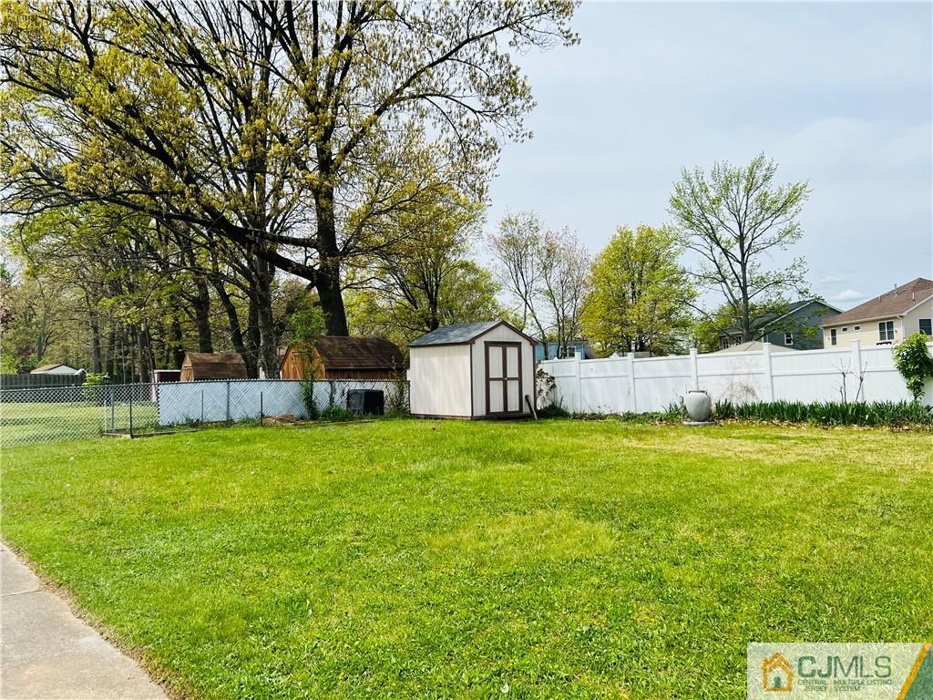 55 Glenville Road Edison, NJ 08817 - Photo 28 of 28 a front view of a house with a garden and trees