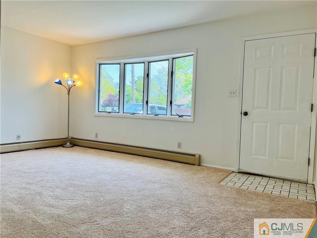 55 Glenville Road Edison, NJ 08817 - Photo 3 of 28 an empty room with windows