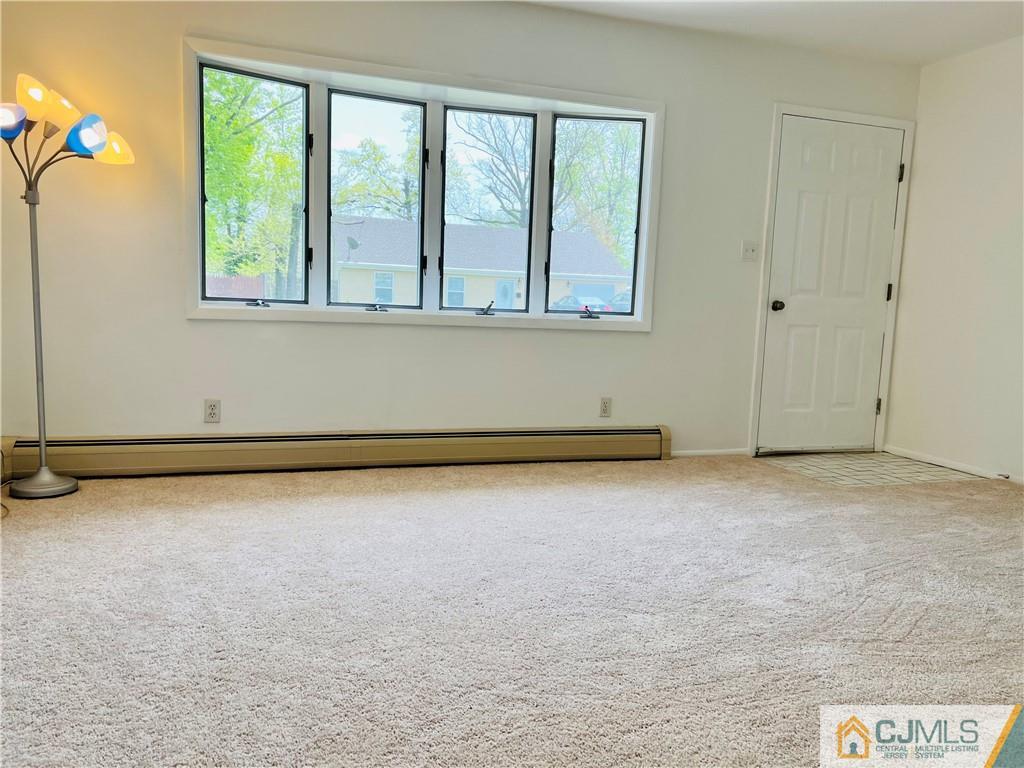 55 Glenville Road Edison, NJ 08817 - Photo 4 of 28 a view of an empty room with a window