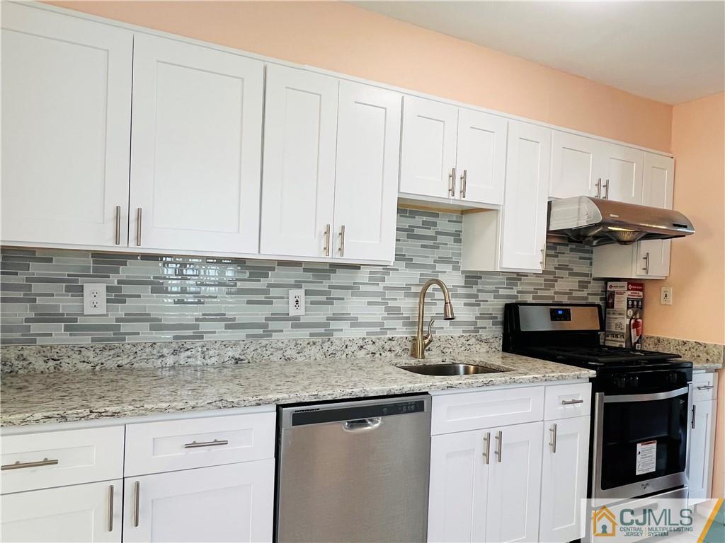 55 Glenville Road Edison, NJ 08817 - Photo 7 of 28 a kitchen with stainless steel appliances granite countertop a sink a stove and a granite counter tops